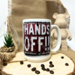 Kubek hands off sign